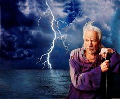 an old man standing in front of a storm with lightning behind him and holding a cane