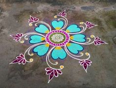 a colorful flower design painted on the ground