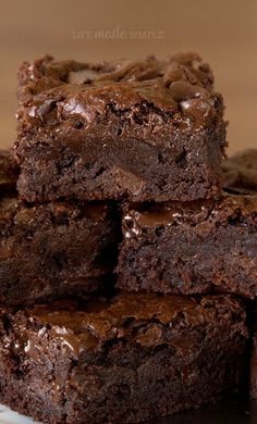 chocolate brownies stacked on top of each other