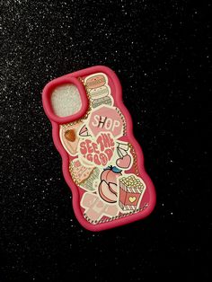 a cell phone case that has some stickers on it