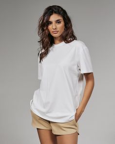 An oversized 4-way stretch cotton tee made intentionally boxy, with the perfect amount of slouch. Wear it with shorts or your favorite pair of jeans. Details Model is 5'10" and wears a size small. Care: Turn inside out. Machine wash cold on delicate cycle with similar colors. Tumble dry on low. Iron on low if needed. Composition: 57% Cotton | 38% Modal | 5% Spandex | 7DIAMONDS Women's Boyfriend T-Shirt in White | Size 2XL White T Shirt Photoshoot, White T Shirts For Women, Oversize Tshirt Outfits, Baggy Shirt, Jeans Details, Pony Club, Boyfriend T Shirt, Boyfriend Tee, Tshirt Outfits