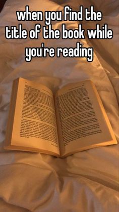 an open book sitting on top of a bed with the caption when you find the title