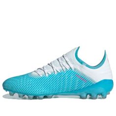 a blue and white soccer shoe on a white background