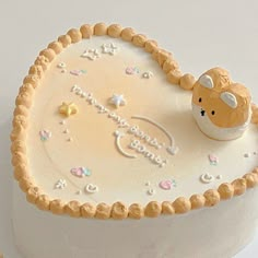 there is a cake that looks like it has a teddy bear on the top and stars in the middle