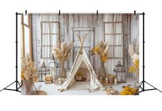 an image of a photo booth set up with flowers and decorations on the floor for photography