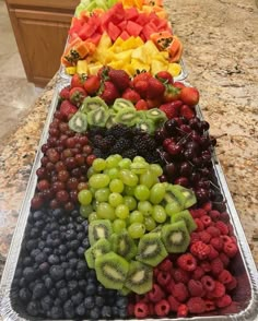 a tray filled with lots of different types of fruit