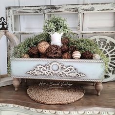 an old dresser with some plants in it