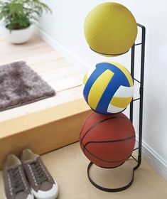 three balls stacked on top of each other with the words ball stand frame above them