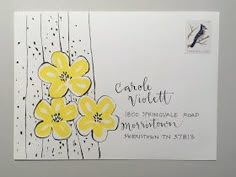 an envelope with yellow flowers on it