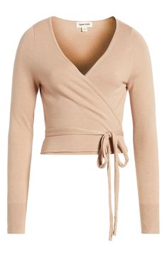 It's a wrap on this sustainably made sweater featuring a waist-tie closure that ensures a fabulous figure-hugging fit every time. 17 1/2" length (size Medium)   Surplice V-neck   Long sleeves   50% Lenzing™ EcoVero™ viscose, 28% polyester, 22% nylon   Lenzing EcoVero viscose is a sustainably produced fiber using pulp made from renewable wood sources and certified with the EU Ecolabel for high environmental standards, including lower emissions and water usage than generic viscose   Hand wash, dry Light Brown Sweater, Water Usage, Natural Tan, Wrap Sweater, Brown Sweater, Waist Tie, Hand Wash, Nordstrom, Long Sleeves