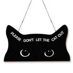 a sign that says please don't let the cat out hanging from a rope