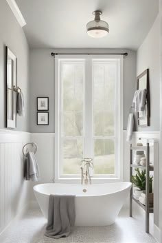 a white bath tub sitting next to a window