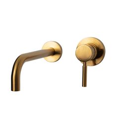 two brass colored faucets on a white background