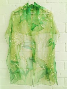 Glamourous Hand painted silk chiffon scarf - Lilies of The Valley in green. Beautiful wild flowers lovely laid out through all length long. This design Scarf is MADE TO ORDER and available in 2 SQUARE and 5 OBLONG sizes (with butterflies or without): 21*x21 inches (55x55cm)- Very small square. Can serve as a kerchief; wrist, head or bag band. 35*35 inches (90*90cm) -Possible various combinations of twisting on neck/chest. XS---59x15 inches (150x40 cm)- quite Small scarf. This size is good who li Green Silk Scarf For Party, Elegant Green Summer Scarves, Elegant Green Scarves For Summer, Elegant Green Scarves For Spring, Elegant Green Floral Silk Scarf, Elegant Green Floral Print Silk Scarf, Spring Wedding Silk Shawl, Spring Party Green Dupatta, Artistic Silk Scarves For Weddings