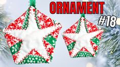 an ornament hanging from a christmas tree decorated with red, green and white stars