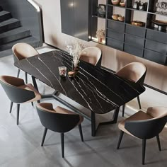 a dining room table with chairs around it