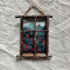 an old window frame with flowers painted on it