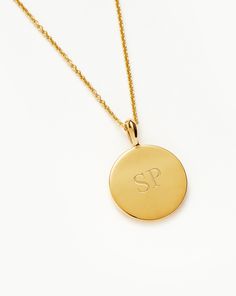 Engravable Round Necklace 18k Gold Vermeil. Make It Personal with a Necklace. Paired with a Delicate Chain, the Smooth Clip-On Pendant Can be Engraved on Both Sides – the Perfect Gift for that Special Someone. Opt for the Engravable Round Disc Pendant. Please Note: Engraving Items May Take 2 Working Days to Process. Metal: 18K Gold Plated Vermeil on Sterling Silver Pendant Dimensions: 15mm Chain Metal: 18K Gold Vermeil on Sterling Silver Short Plain Chain: Total Length 450mm with Extension Links at 410mm, 430mm and 450mm Weight: 4. 7 g Product Code: En-G-N1-Ns Double Chain Bracelet, Malachite Necklace, Mixed Metal Jewelry, Coin Pendant Necklace, Earring Trends, Pearl And Diamond Earrings, Round Necklace, Solid Gold Earrings, Disc Pendant