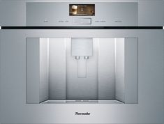 a stainless steel wall oven with the door open to show it's light inside