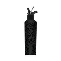 a black bottle with scissors sticking out of it