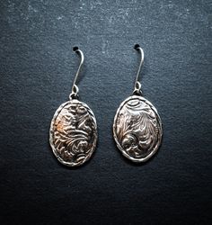 Sterling silver earrings with Sheridan style leather texture, Silver ear wires. All handmade by me here in Texas! Western Earrings, Oval Earrings, Oval Earring, Leather Texture, Custom Rings, Sterling Silber, Ear Wires, Sterling Silver Earrings, Jewelry Earrings Dangle