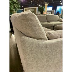 a couch and loveseat are on display at a furniture store in an indoor setting