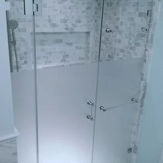 a walk in shower sitting inside of a bathroom