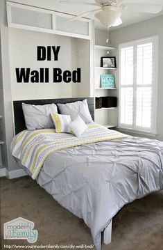 a bed sitting in a bedroom next to a white book shelf with books on it