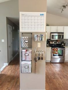 a refrigerator with magnets and drawers in a kitchen