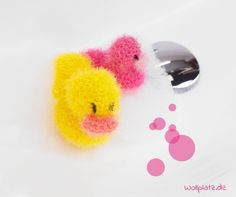 two stuffed animals are next to a faucet with bubble bubbles in the air