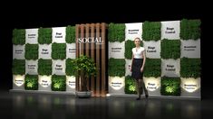 a woman standing in front of a wall with plants on it and the words social