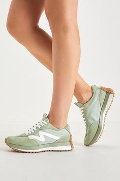 Take to the streets like a style icon in the Steve Madden Campo Sage Green and White Suede Color Block Sneakers! Soft genuine suede leather and mesh fabric (in a sage green and white design) come together to shape these trend-setting sneakers that have an almond-shaped toe upper and a classic lace-up vamp with a pull tab at the tongue. A textured, brown platform sole extends up the heel and completes the look. Shiny logo decal at heel. 1. 25" rubber heel. Cushioned insole. Rubber sole has nonski Sage Green Sneakers, Sage Green Shoes, Sage Green Fashion, Sage Sneakers, Nurse Shoes, Spring Capsule, Lulu Fashion, Green Sneakers, Nursing Shoes