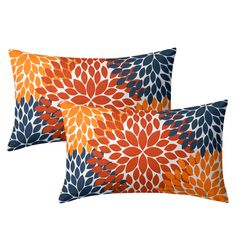 two orange and blue pillows with large flowers on the front, one has an orange flower design