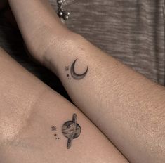 two people with tattoos on their legs, one is holding the other's arm