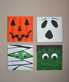 four square paintings with faces painted on them in different colors and shapes, each decorated as a halloween jack - o - lantern