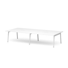 a white table sitting on top of a white floor