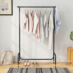 a rack with clothes and shoes hanging on it