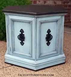 an old cabinet painted blue with black accents