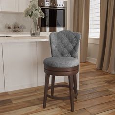 a kitchen with a counter, sink and bar stools in it's center