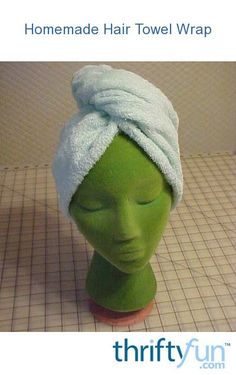 a green mannequin head with a towel wrapped around it's head and the words, one - seam bath towel turban