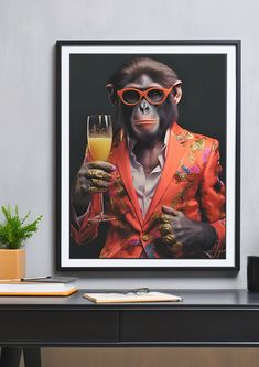 a monkey in an orange suit and sunglasses holding a glass of wine on a table