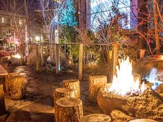 a fire pit in the middle of a park at night