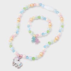 Style your little one with the Toddler Rainbow Unicorn Necklace & Bracelet from Cat & Jack™. This delightful 2-piece set includes a pull-on necklace and a snap-on bracelet, both featuring adorable unicorn charms in vibrant rainbow colors. Made from zinc alloy, acrylic and iron, this set is designed for toddlers to bring all the vibes to their outfits in an instant. Cat & Jack™: Designed for all children so you can trust it's made for yours. Glowing Necklace, Unicorn Charm, Charm Choker Necklace, Unicorn Necklace, Bff Necklaces, Choker Necklace Set, Boys Accessories, Rainbow Unicorn, Sequin Mini