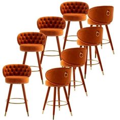 six orange velvet bar stools with gold studding and buttons on the backrest