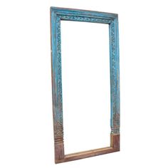 an old wooden frame with blue paint and carvings on the edges, isolated against a white background