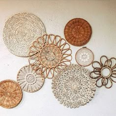 wicker baskets are arranged on the wall in order to be used as decorative pieces