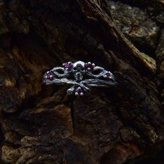 Featuring intricate skull details, this Gothic Mens Wedding Ring is the perfect choice for those seeking a fantasy-themed and vintage-inspired aesthetic. The unique design makes it an exceptional piece for gothic forest jewelry enthusiasts. Characteristics: Metal - Recycled solid sterling silver  Stone - Cubic Zirconia Finish - Oxidized. View all silver gothic rings: https://www.etsy.com/shop/TinyShinyJewel?ref=seller-platform-mcnav&section_id=42765371 Care instructions: To care for the ring, avoid contact with water and chemicals such as perfumes and lotions. When the ring is not in use, store it in a dry, cool place to prevent tarnishing. Additional information:  ✦ All rings are made to order. An average turnaround time is 1-5 days. I will make every effort to ship the ring sooner. ✦ FRE Gothic Skull Wedding Rings, Silver Spiritual Skull Ring For Anniversary, Gothic Sterling Silver Wedding Rings, Silver Gothic Skull Ring For Anniversary, Mystical Silver Rings For Weddings, Mystical Silver Rings For Wedding, Sterling Silver Skull Ring For Wedding, White Gold Sterling Silver Skull Ring For Wedding, Gothic Forest