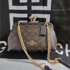 Beautiful Bag. Classic Coach, Print Brown And Black Monogram Clock Crossbody Bag Adjustable Removable Strap Can Be Used As A Clutch. Brown Bags With Branded Hardware For Evening, Luxury Brown Shoulder Bag Clutch, Evening Brown Shoulder Bag With Branded Hardware, Coach Shoulder Bag With Brass Hardware, Brown Coach Satchel For Evening, Brown Evening Shoulder Bag With Branded Hardware, Brown Clutch Shoulder Bag With Branded Hardware, Brown Crossbody Clutch With Dust Bag, Brown Evening Shoulder Bag With Brass Hardware