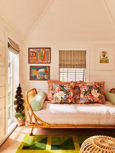 a living room filled with lots of furniture and decor