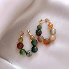 Add a pop of color to your jewelry collection with our Colorful Natural Agate Earrings. Made from high-quality agate stones, these earrings offer a unique and vibrant look. Embrace nature's beauty while elevating your style with these stunning earrings.

Natural agate
Size:35*25mm
Weight:8g/pair
High quality zinc alloy
Hypoallergenic, lead and nickel free

*We carefully select each stone to provide the best quality stones. Since the stones are natural materials, the stone color may vary slightly Hot Necklaces, Texture Stone, Ethnic Earrings, Childrens Jewelry, Beaded Hoop Earrings, Beaded Hoops, Fashion Elegant, Dream Jewelry, Jewelry Earrings Hoops